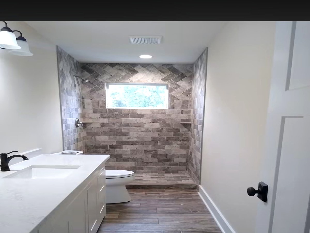 Herringbone Tile Shower & Patterned Floor